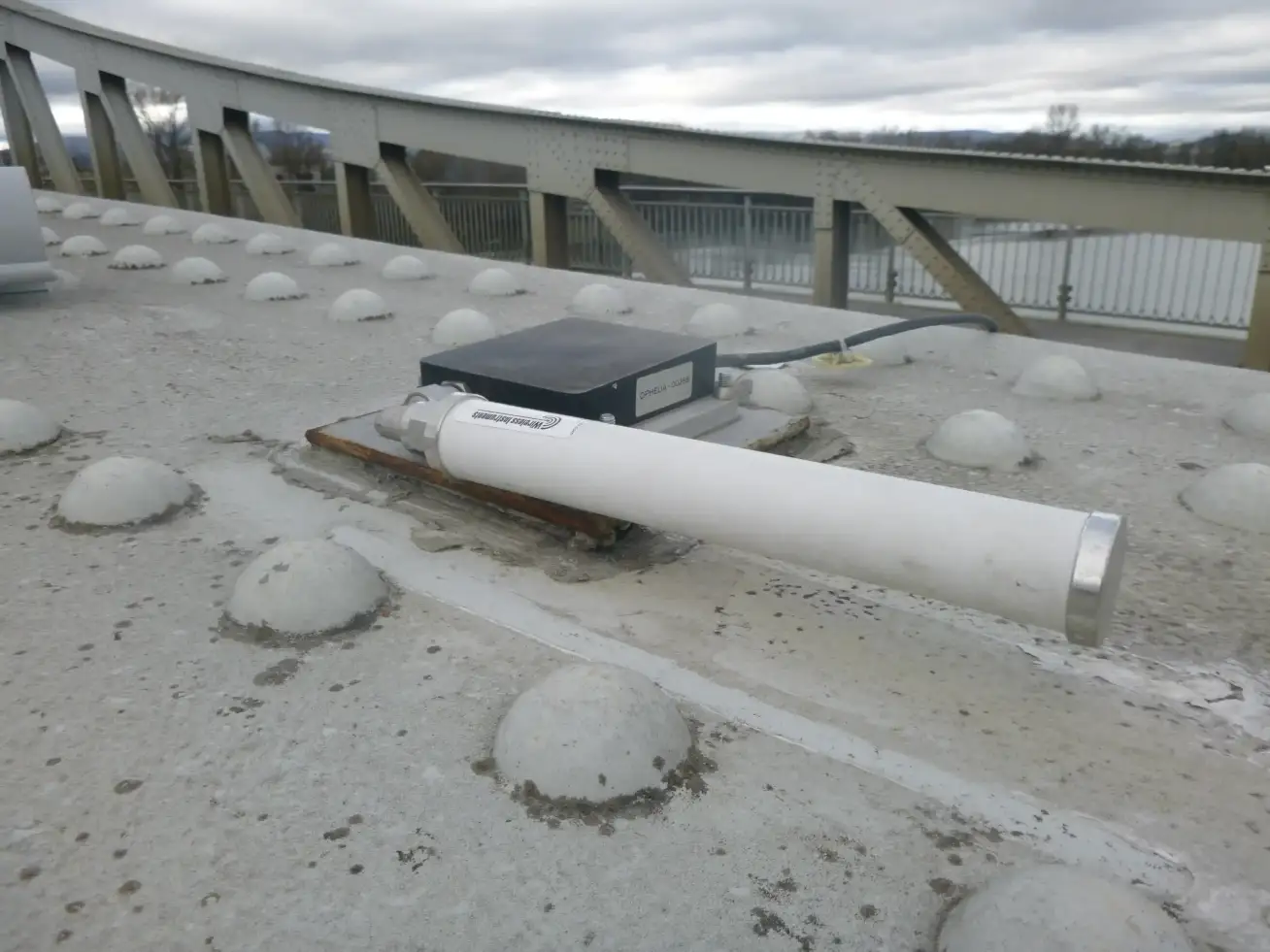 GPS sensor installation on bridge structure with monitoring equipment